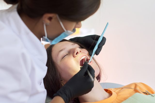 sedated patient with dentist