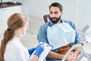 patient talking with dentist